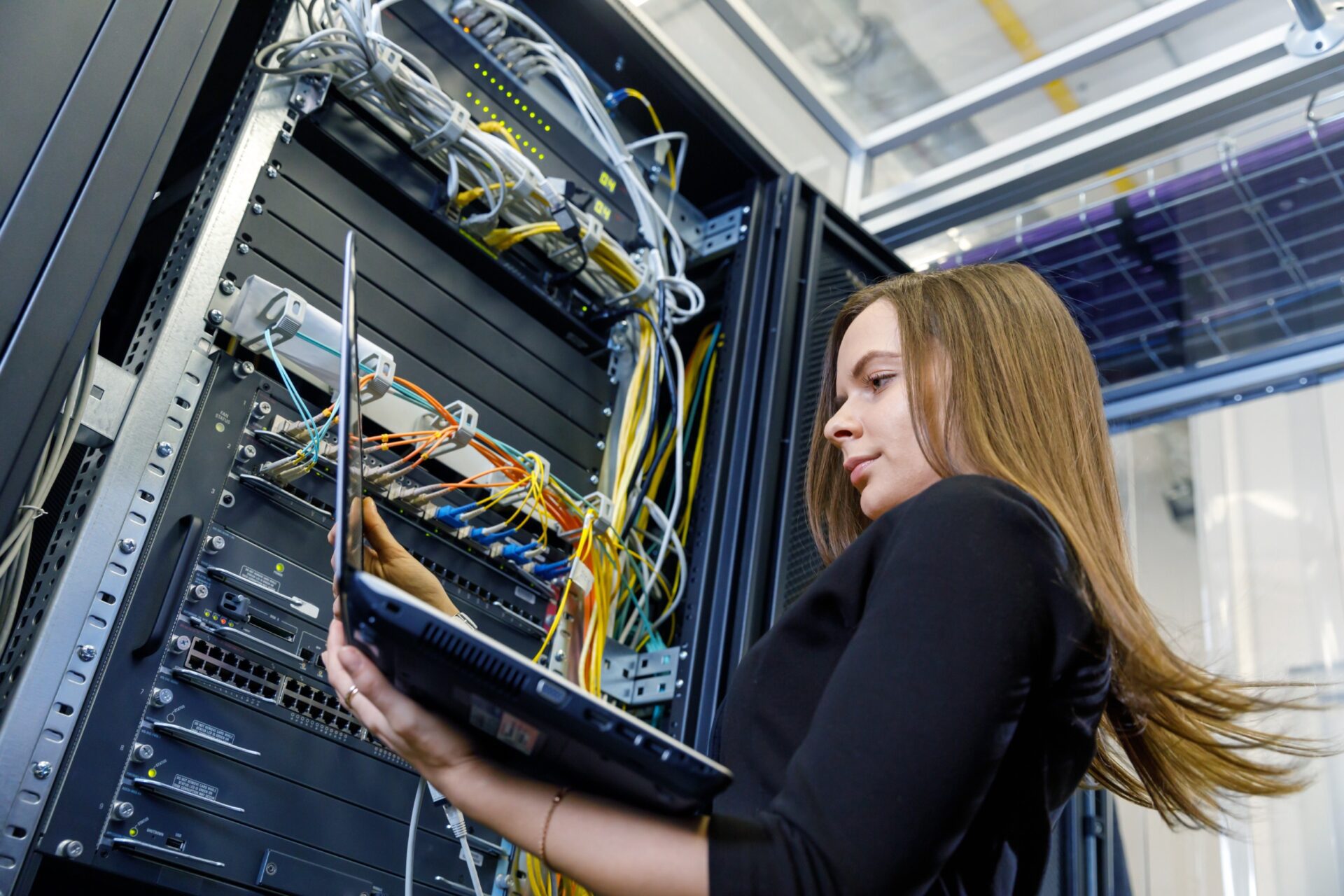Young woman engineer at the network equipment Young woman engineer at the network equipment
